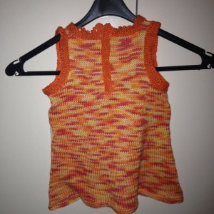 Backside of dress with buttons to close the neck